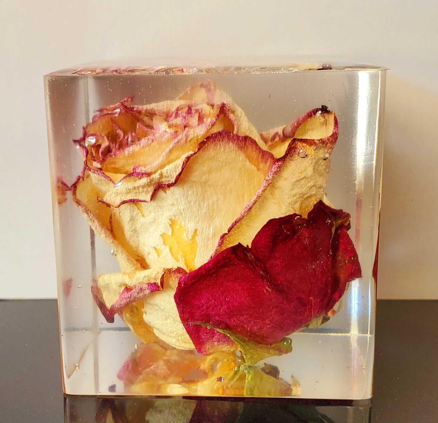 Handcrafted 2x2 cubed resin cube with a pink real rose inside