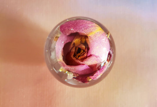 Handcrafted round resin sphere w/real purple rose