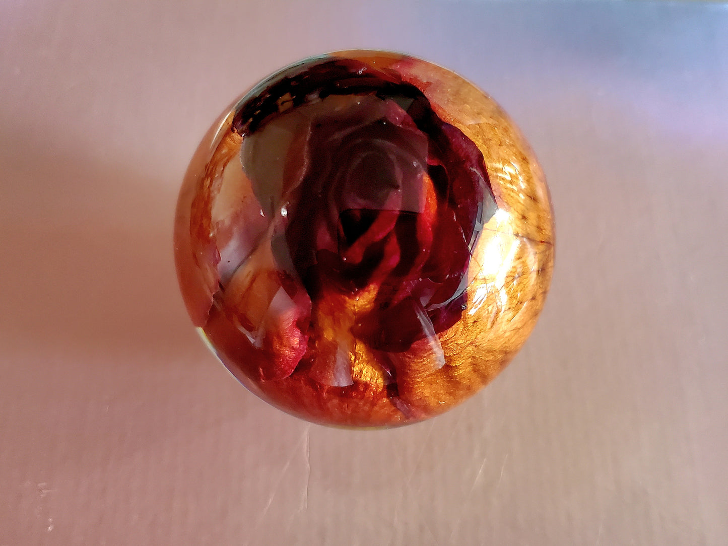 Handcrafted round resin sphere w/real red rose