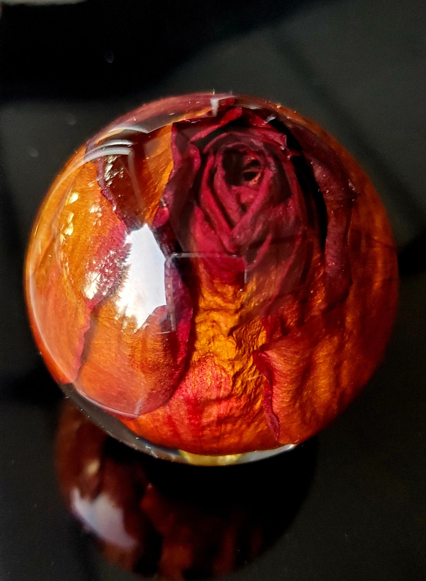 Handcrafted round resin sphere w/real red rose